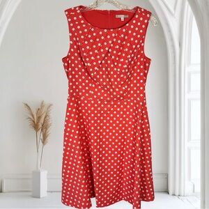 Signature Darby polka dot fit and flare sleeveless dress in a coral melon color